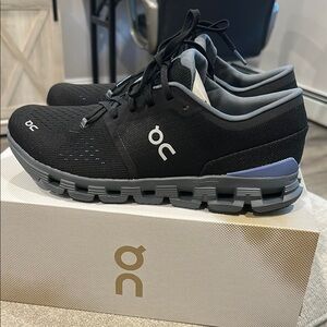 On Running Black and Gray Athletic Shoes with CloudTec Cushioning